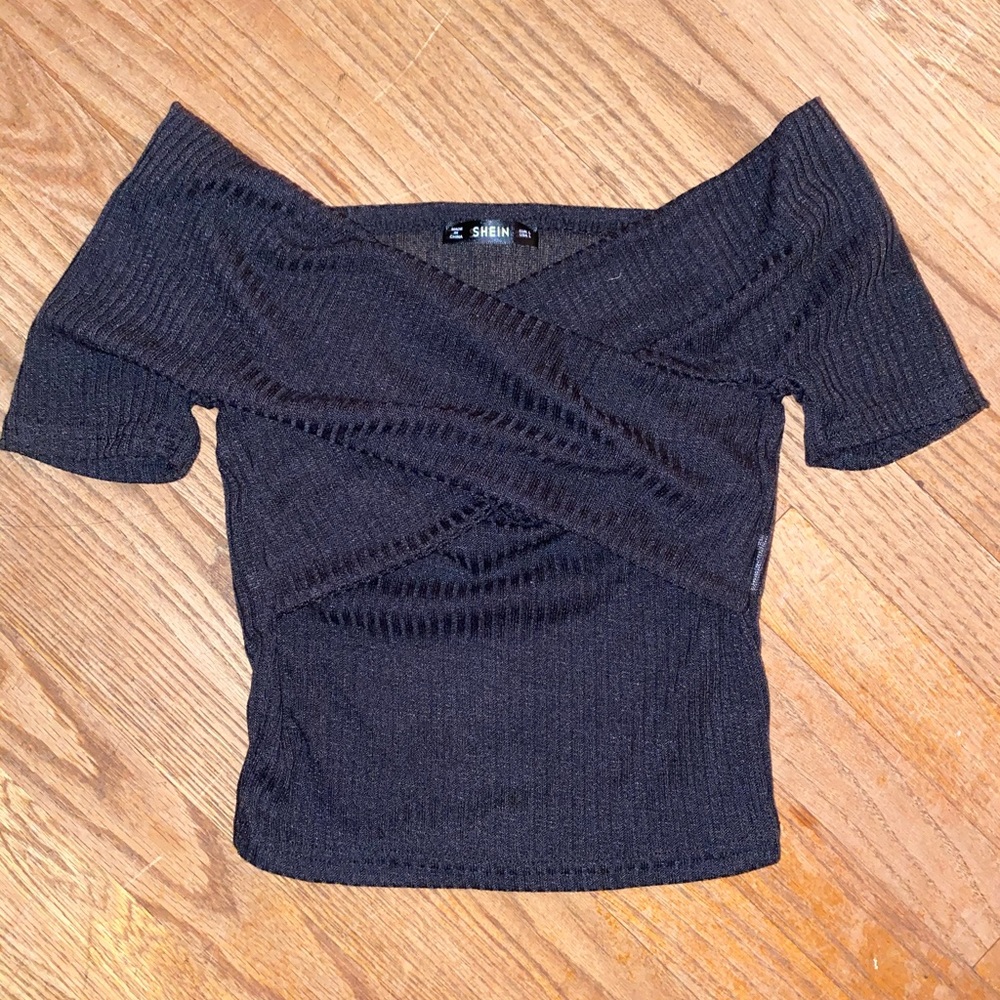 Black off the shoulders top. Fits really small